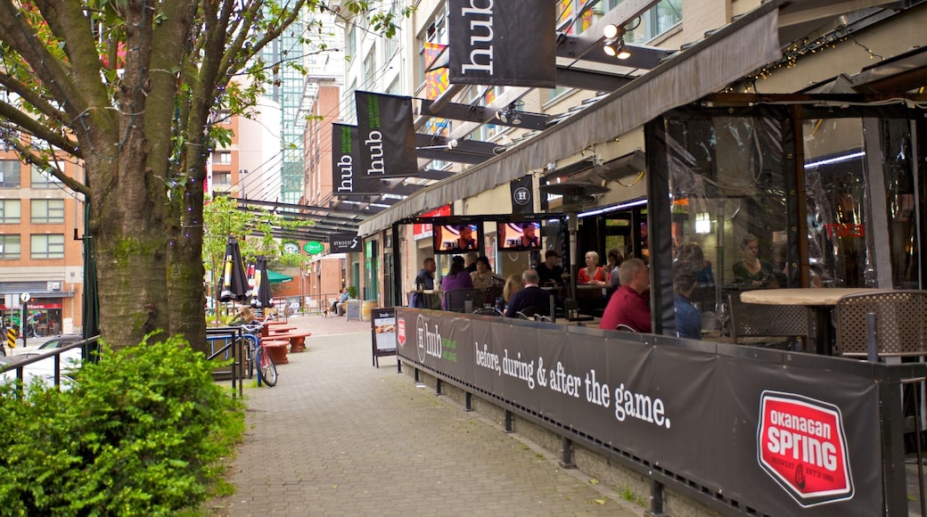 Yaletown which includes a city, street scenes and a bar