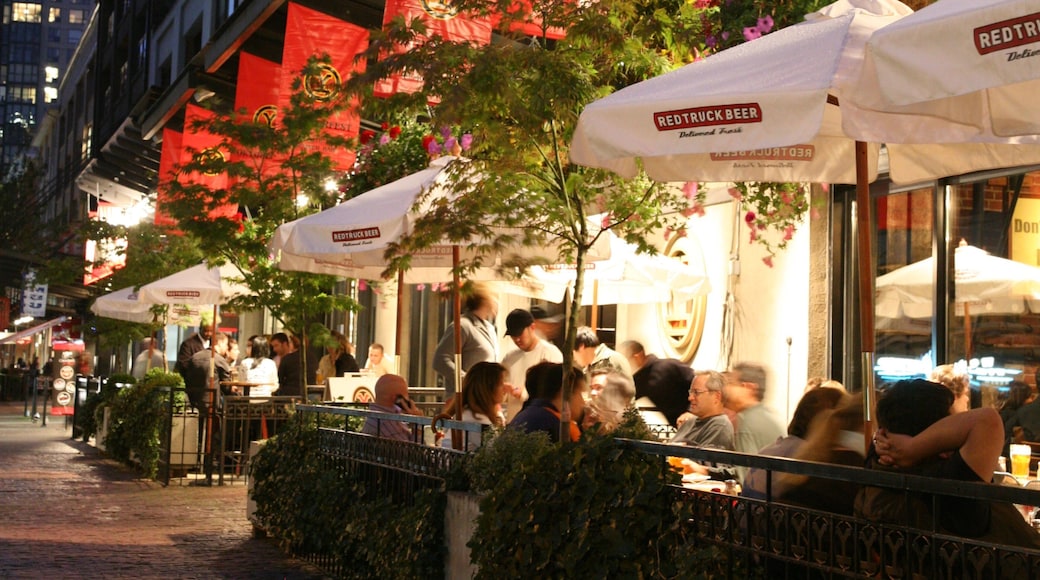 Vibrant outdoor dining scene in Yaletown, Vancouver with lively atmosphere and city lights
