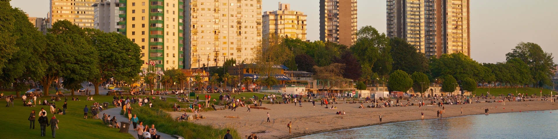Sunset at English Bay with Inukshuk and Cityscape in Vancouver