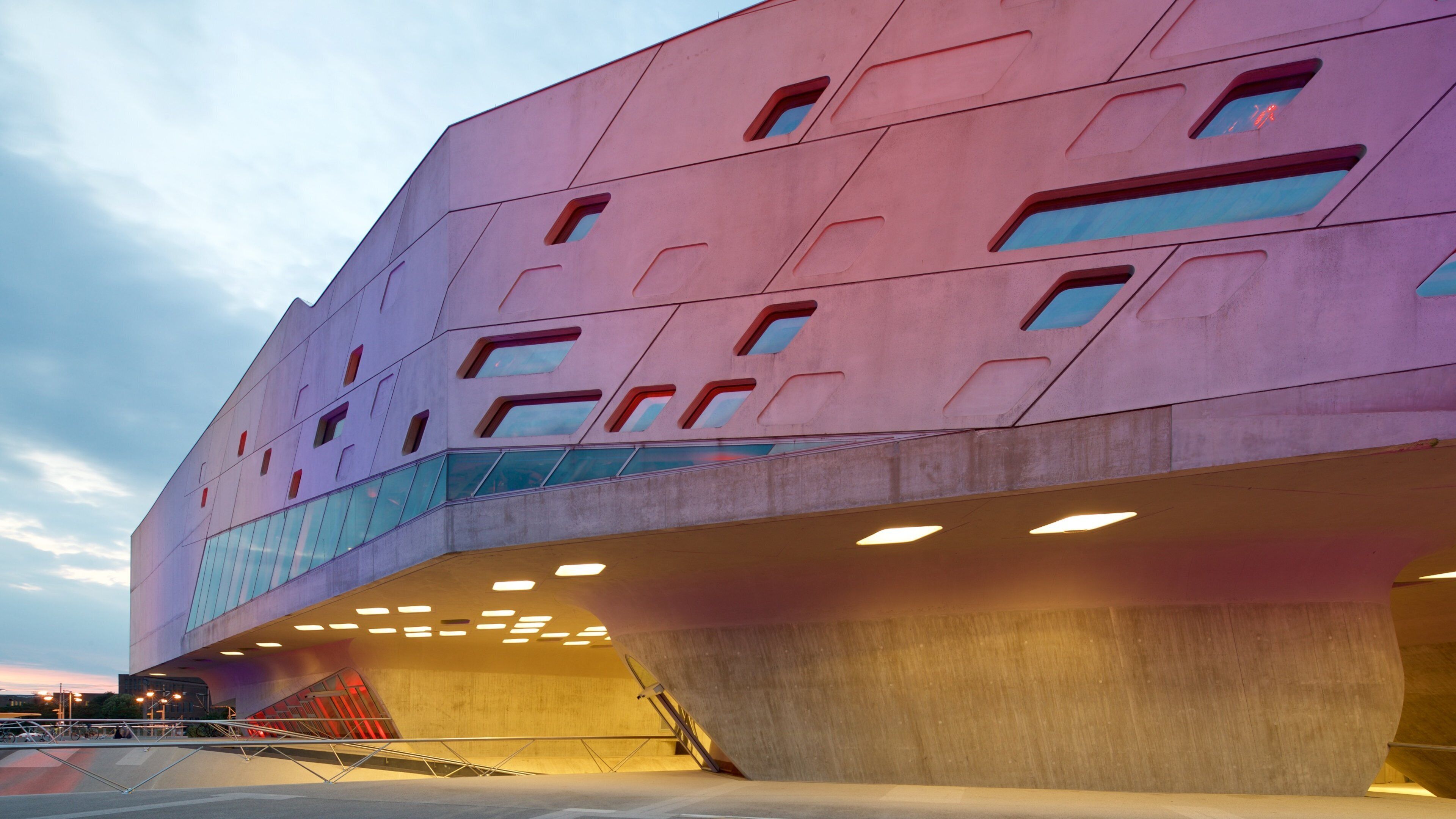 Phaeno Science Center which includes modern architecture and a sunset