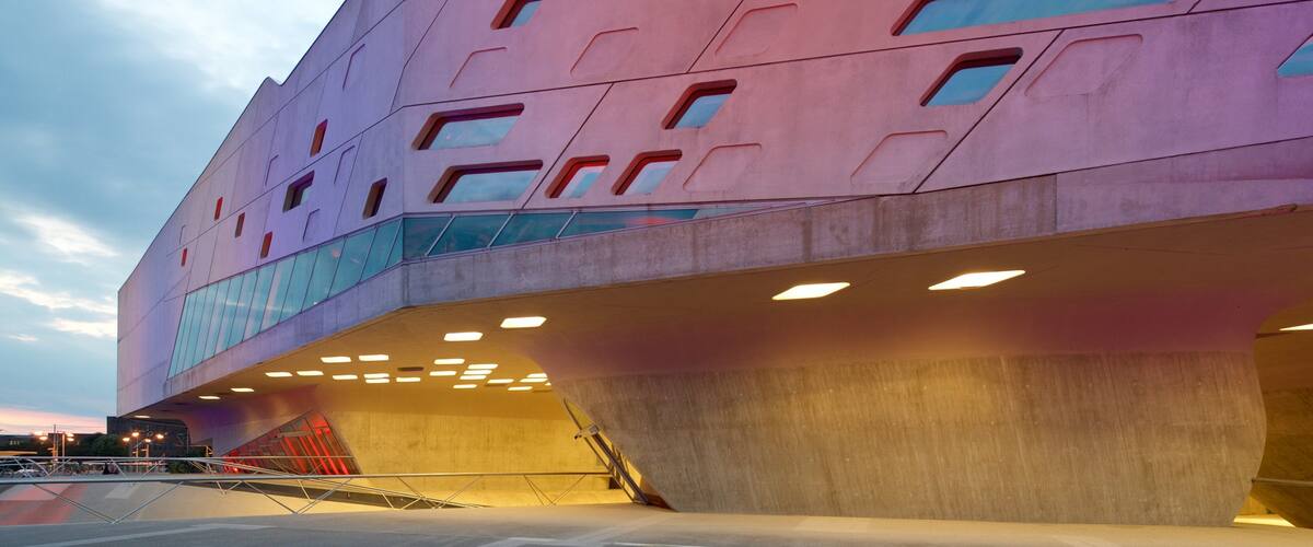 Phaeno Science Center which includes modern architecture and a sunset