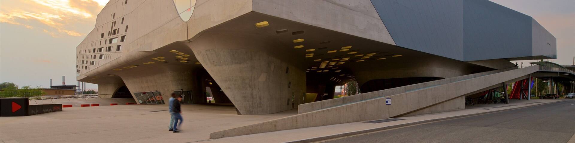 Phaeno Science Center showing modern architecture and a sunset