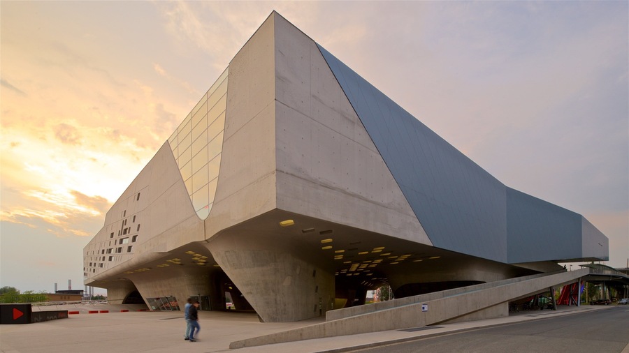 Phaeno Science Center featuring modern architecture and a sunset