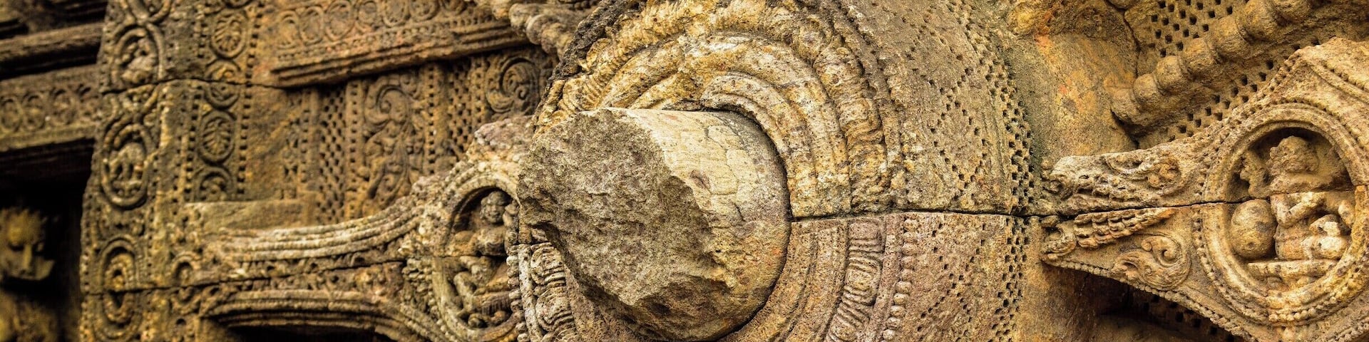 Detailed stone carvings with intricate patterns and figures.