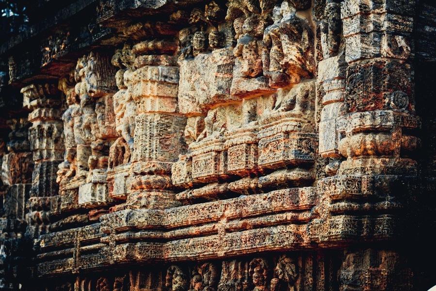 Konark Sun Temple is a 13th-century CE Sun Temple at Konark in Orissa, India. It is believed that the temple was built by king Narasimhadeva I of Eastern Ganga Dynasty in 1255 CE. The temple complex is in the shape of a gigantic chariot, having elaborately carved stone wheels, pillars and walls. A major part of the structure is now in ruins. The temple is a UNESCO World Heritage Site and has also featured on various list of Seven Wonders of India. The temple is 35 km from Puri and 65 km from Bhubaneswar.
The name Konark derives from the combination of the Sanskrit words, Kona (corner or angle) and Ark (the sun), in reference to the temple which was dedicated to the Sun God Surya.