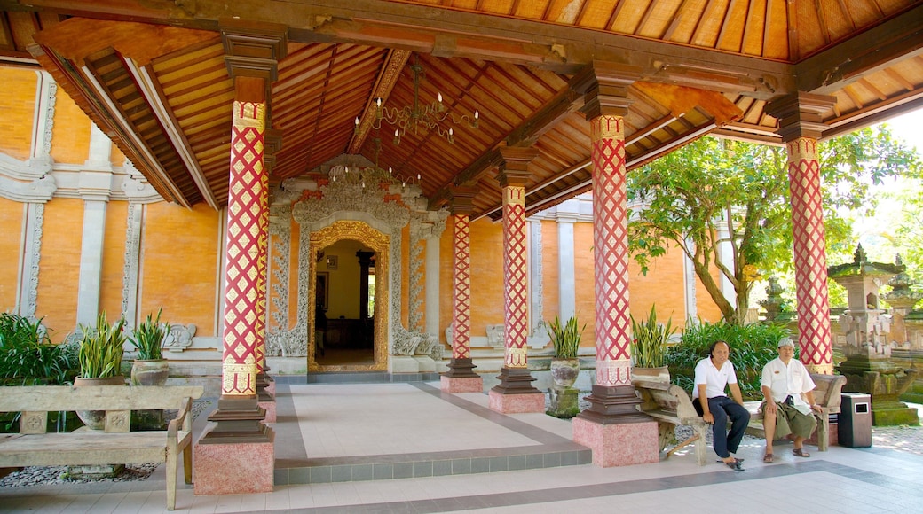 Agung Rai Museum of Art which includes a temple or place of worship and religious aspects as well as a small group of people