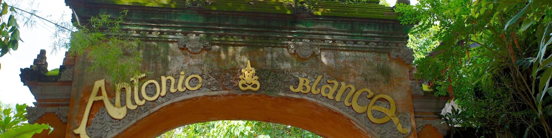 An ornate stone archway with the inscription "Antonio Blanco".