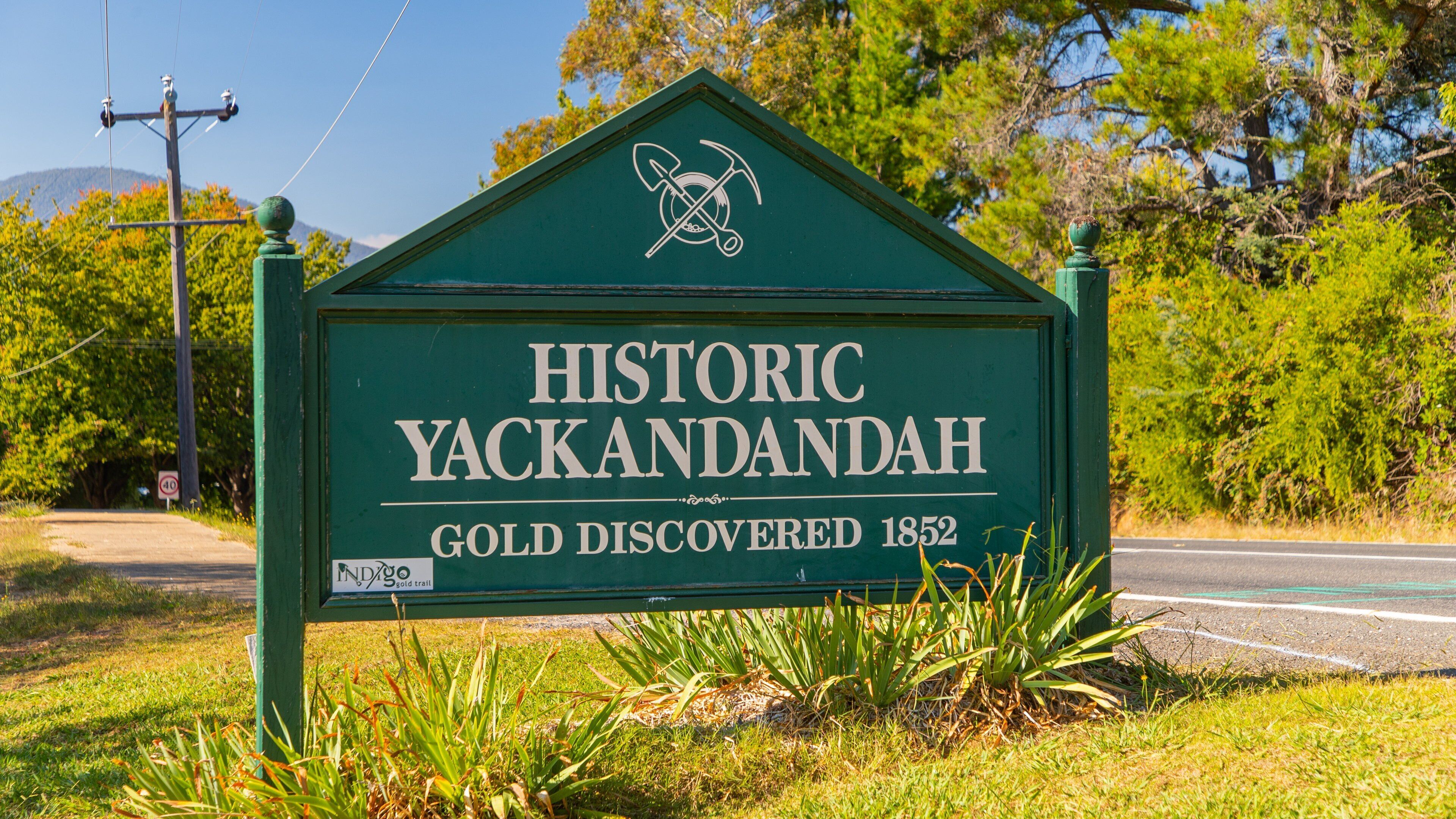 A green sign with the text "Historic Yackandah Gold Discovered 1852" and a logo.