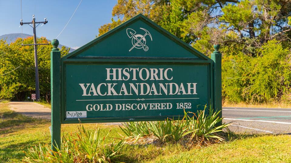 A green sign with the text "Historic Yackandah Gold Discovered 1852" and a logo.