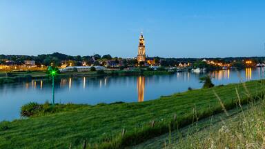 Skyline of the city of Rhenen during the evening with Cunera church and river Nederrrijn in the provence of Utrecht in the Netherlands