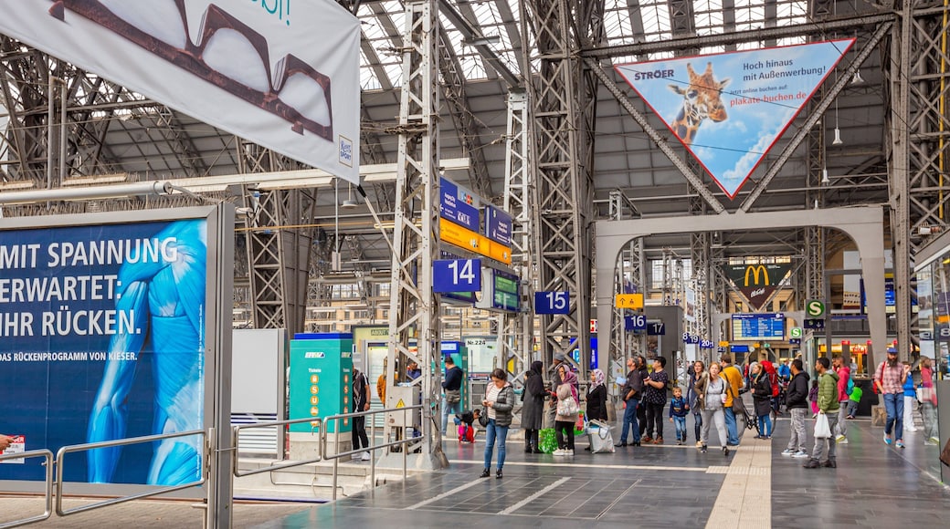 Bahnhofsviertel featuring interior views as well as a large group of people