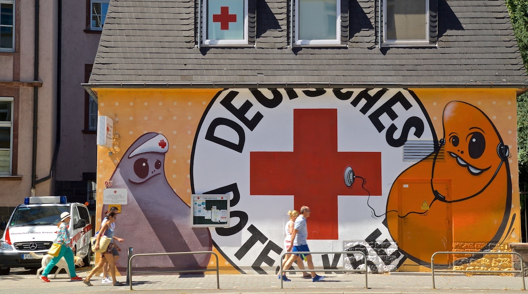 Bornheim featuring street scenes and outdoor art as well as a small group of people