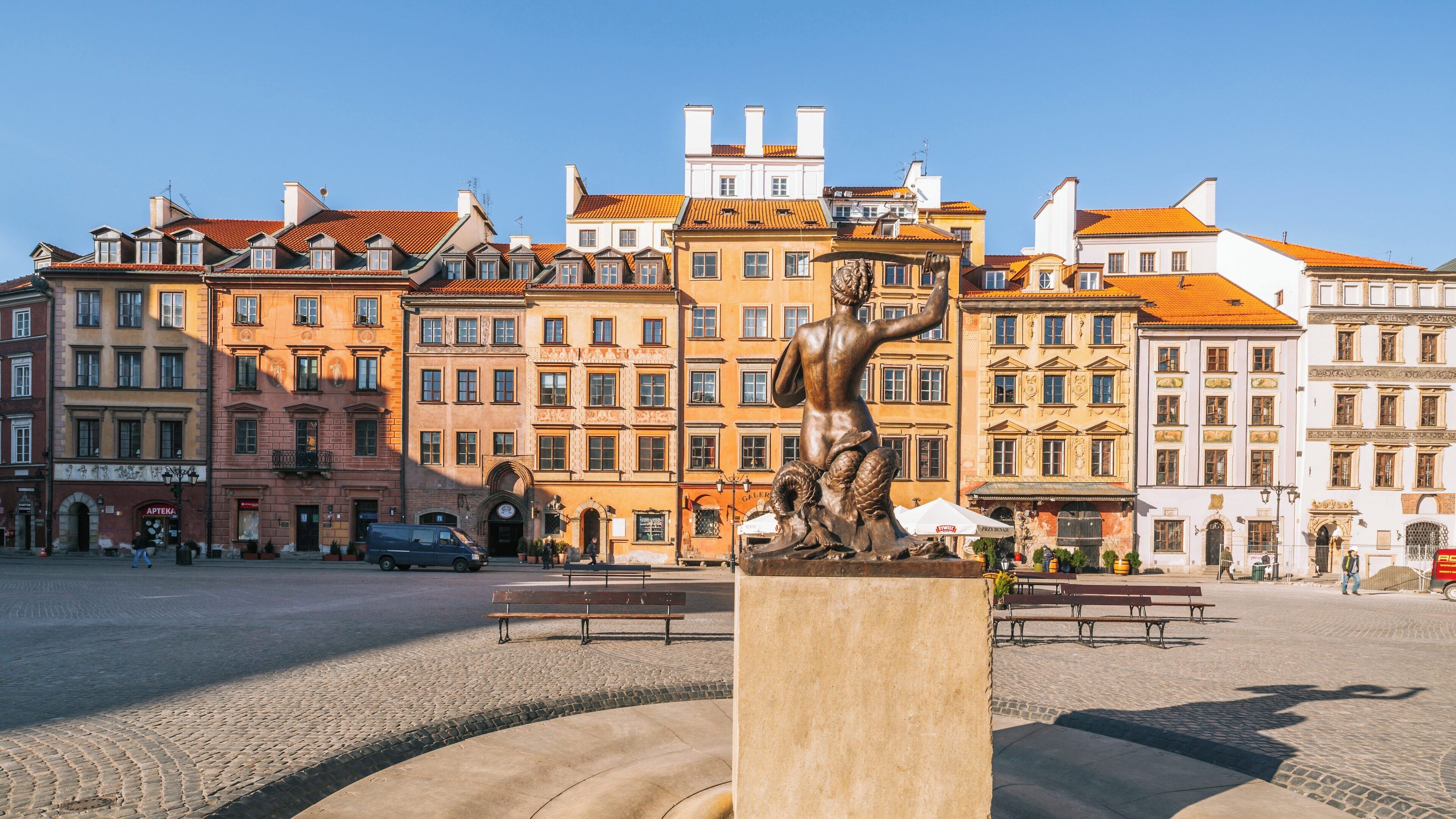 Mermaid statue in Srodmiescie square, Warsaw showcases historical architecture and serene urban scenery