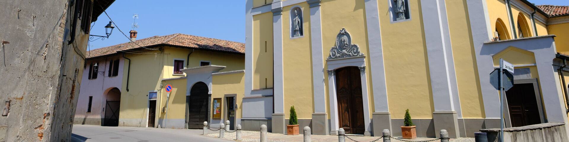 Old buildings at Corneliano Bertario, historic village in Milan province, Italy: San Giorgio church