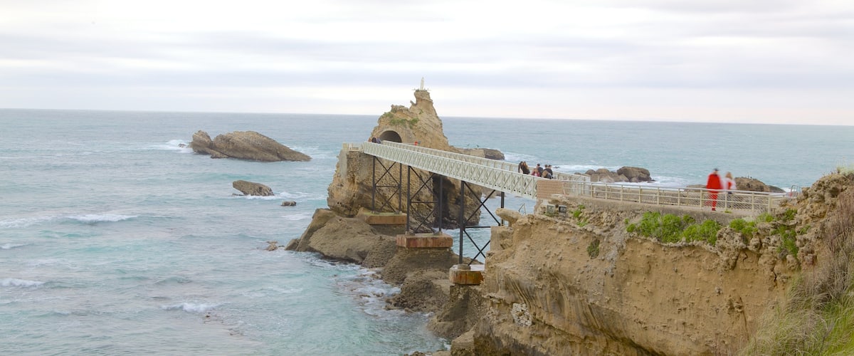 Virgin\'s Rock showing rocky coastline, a bridge and landscape views