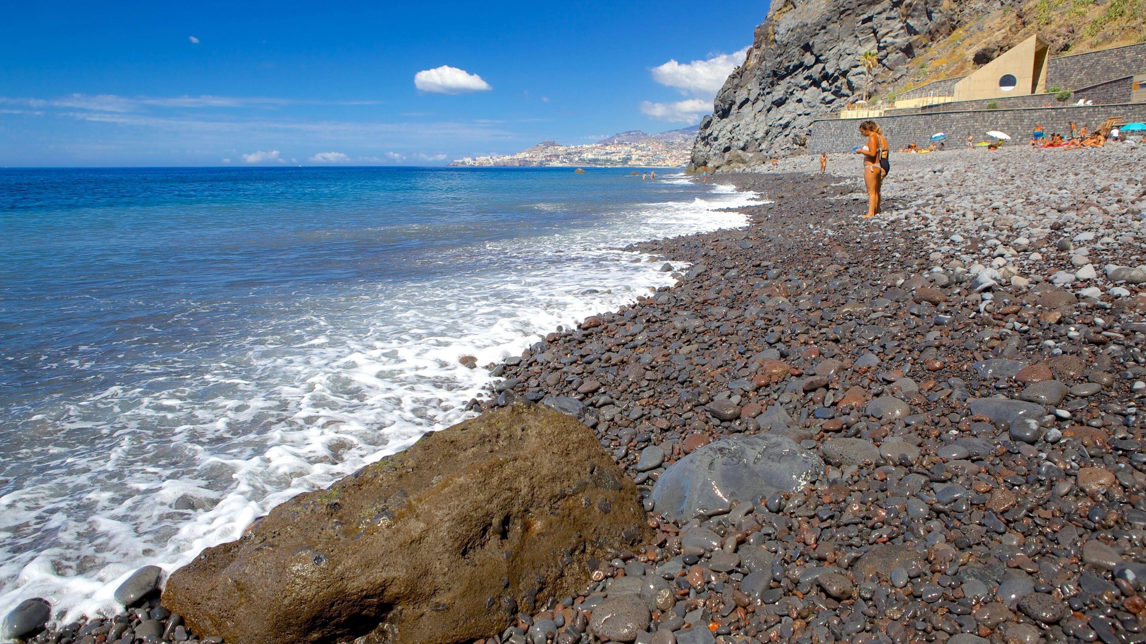 Reis Magos Beach which includes a pebble beach as well as an individual femail