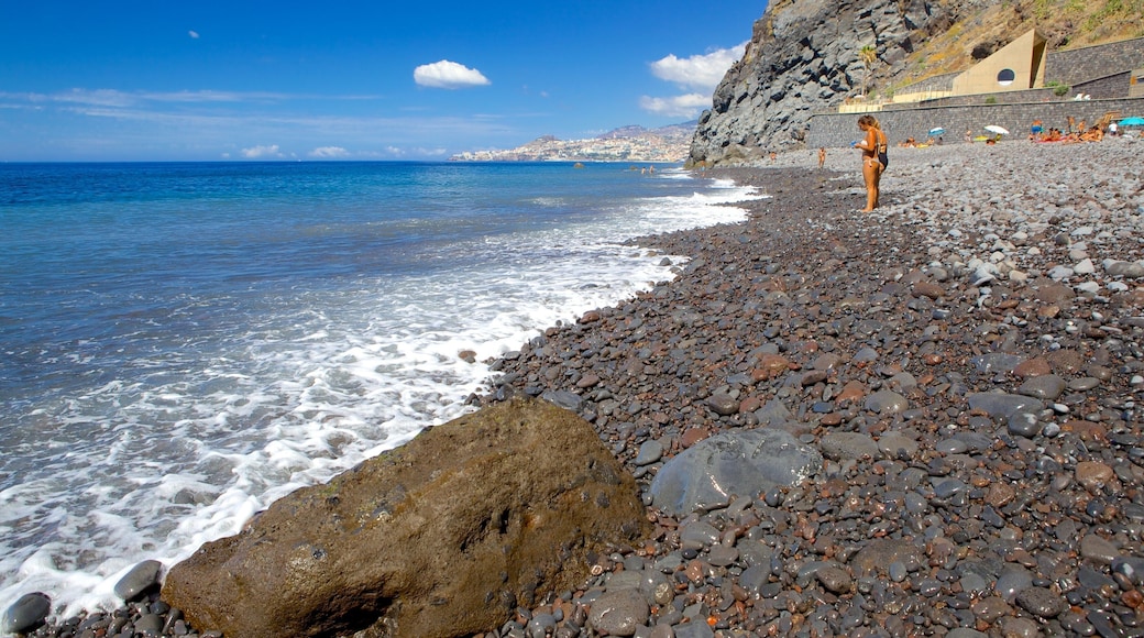 Reis Magos Beach which includes a pebble beach as well as an individual femail