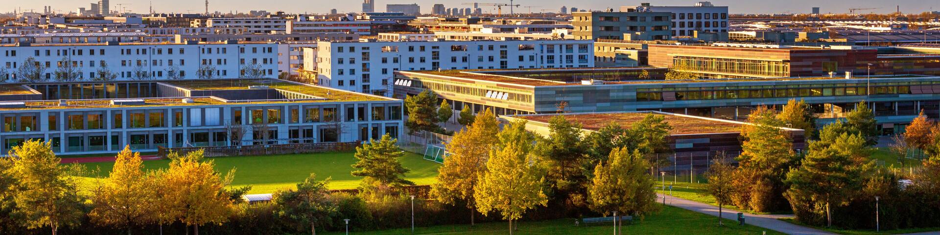 Autumn cityscape - view of the Munich district of Messestadt Riem with Riemer Park, Munich, Bavaria, Germany