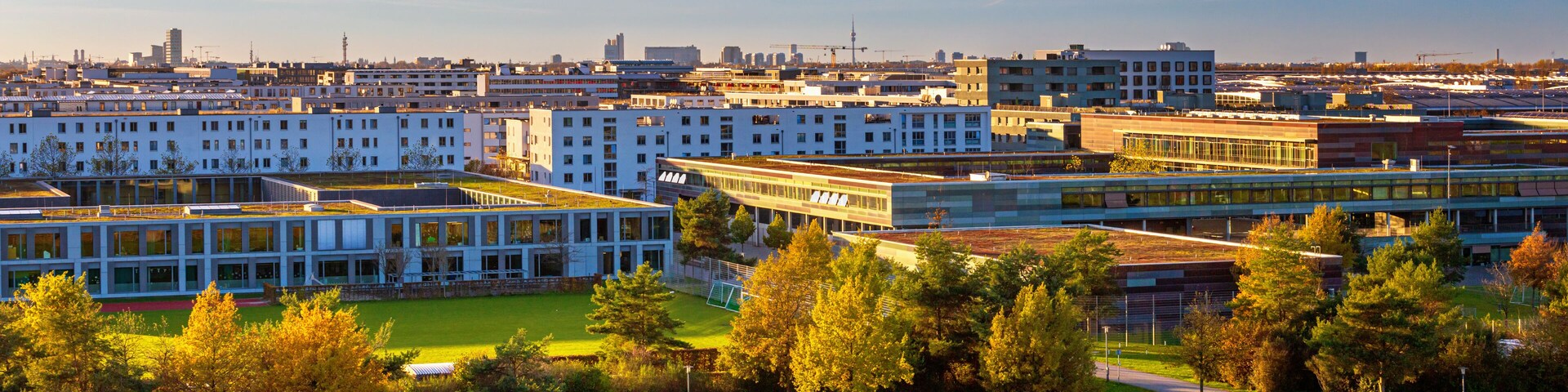 Autumn cityscape - view of the Munich district of Messestadt Riem with Riemer Park, Munich, Bavaria, Germany