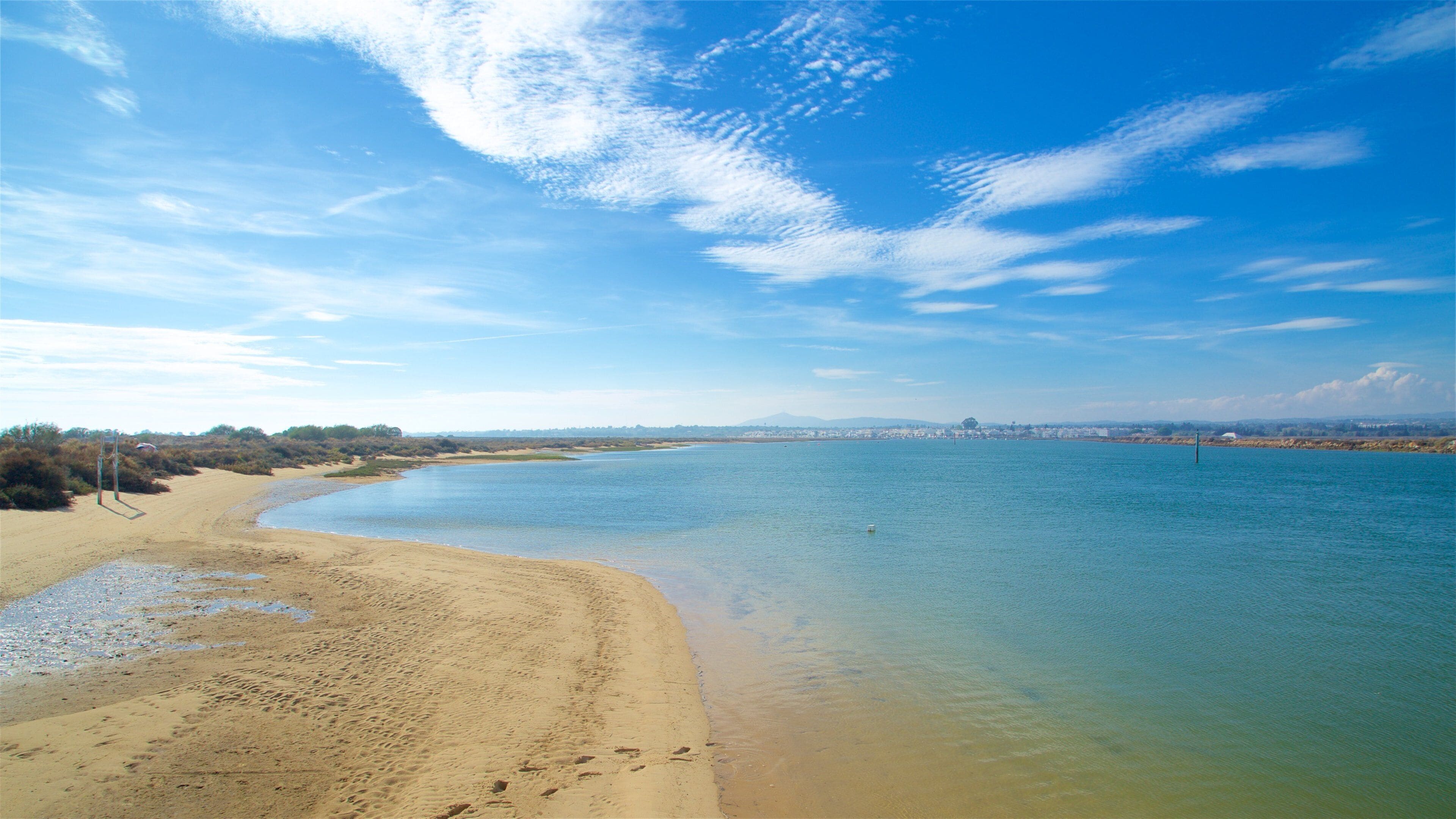 Ilha de Tavira Beach featuring general coastal views and a sandy beach