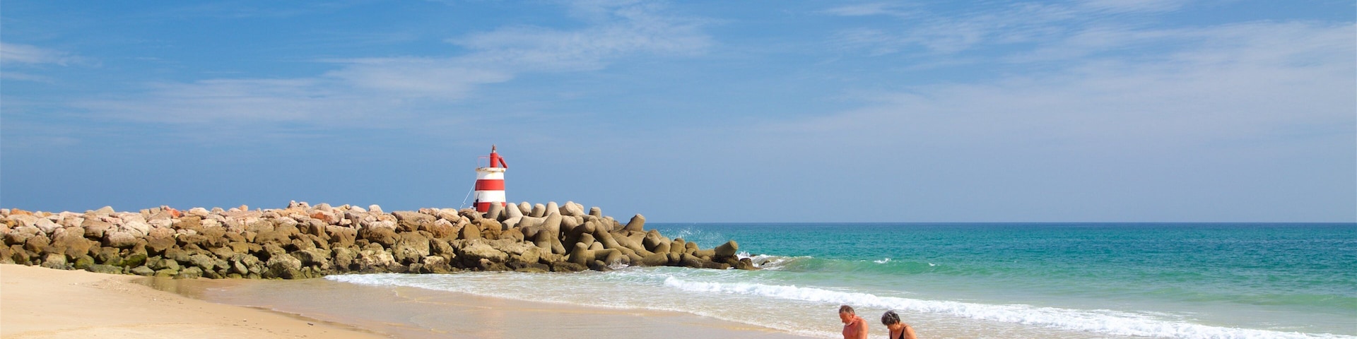 Strand Praia da Ilha de Tavira welches beinhaltet allgemeine KĂŒstenansicht, FelskĂŒste und Strand
