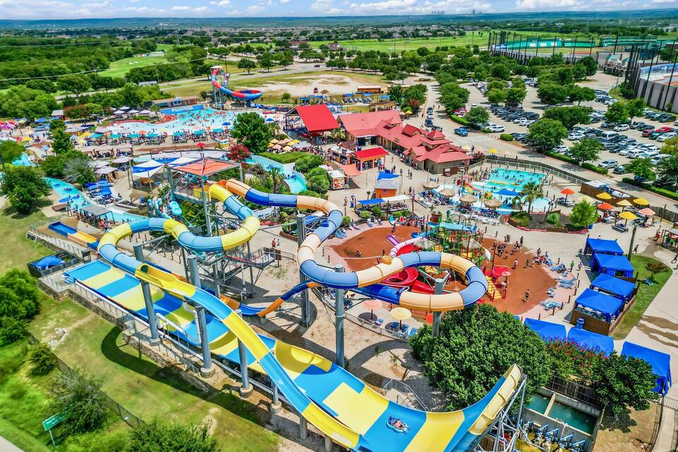 A water park with multiple slides and pools.