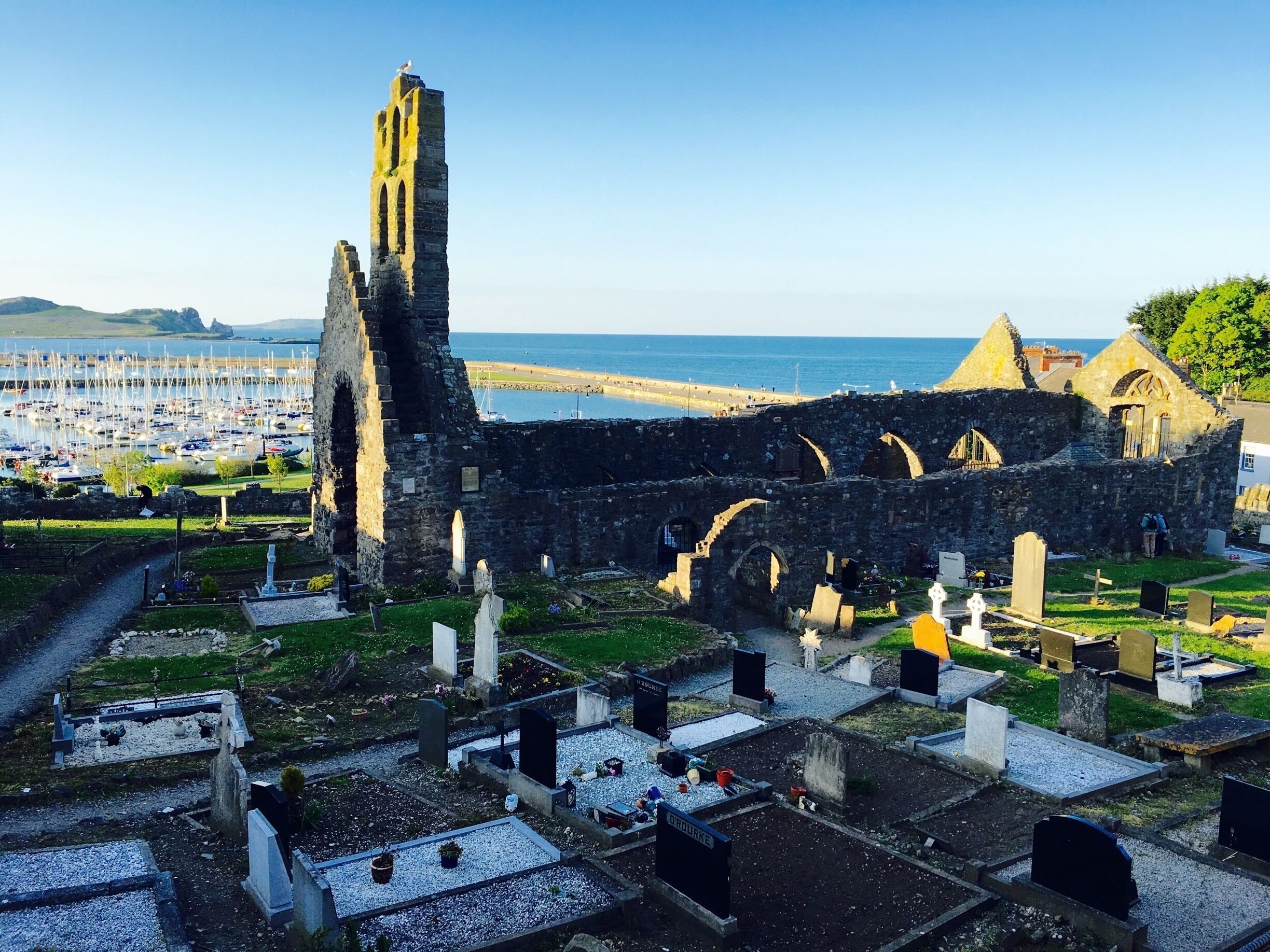 Saint Marys Church and Graveyard with the Howth Harbour background. 

