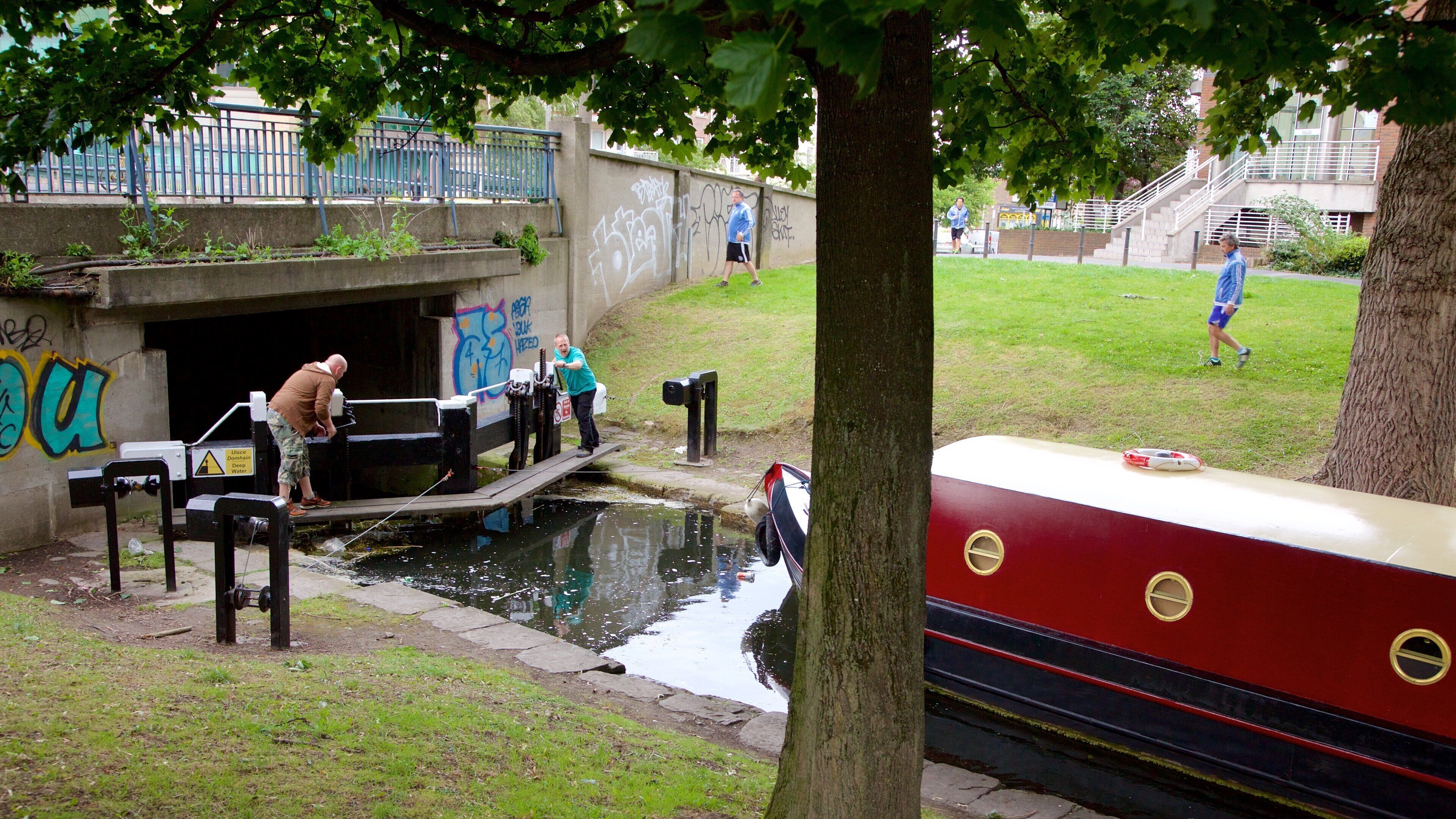 Grand Canal which includes a river or creek and boating as well as a small group of people