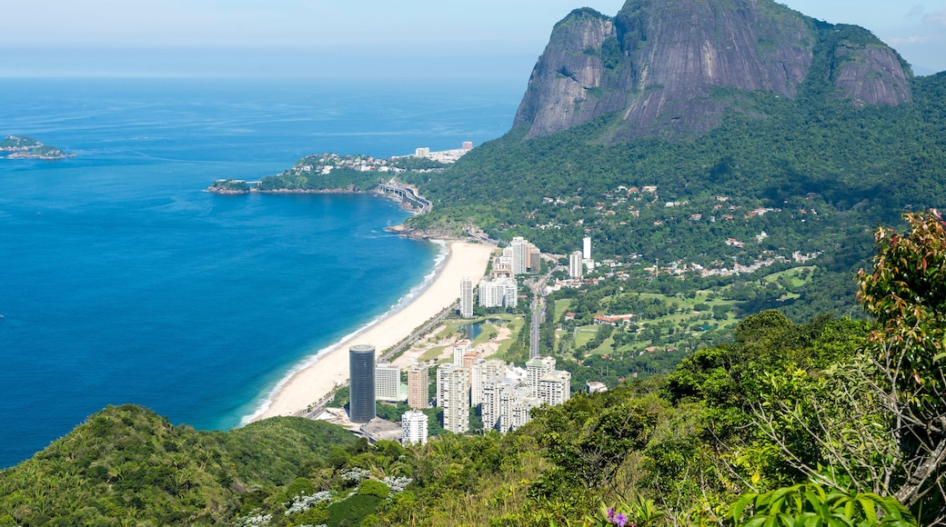 Scenic skyline view from above Sao Conrado Beach with Pedra da Gavea mountain and the favela community of Rocinha in Rio de Janeiro, Brazil