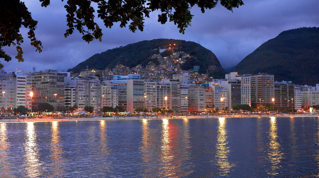 Copacabana Fort which includes night scenes, general coastal views and a city
