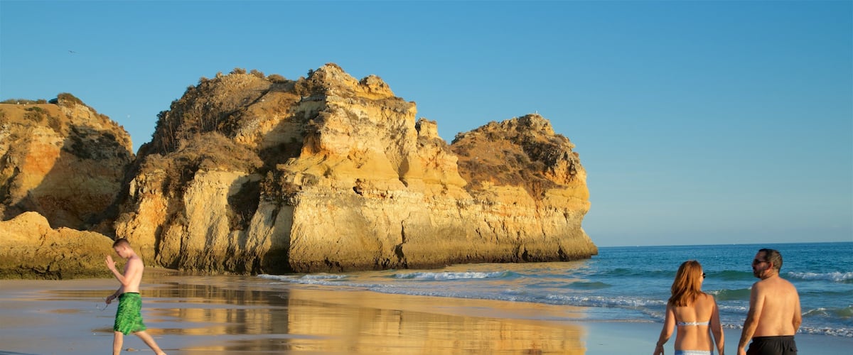 Tres Irmaos Beach showing a sandy beach, general coastal views and rugged coastline