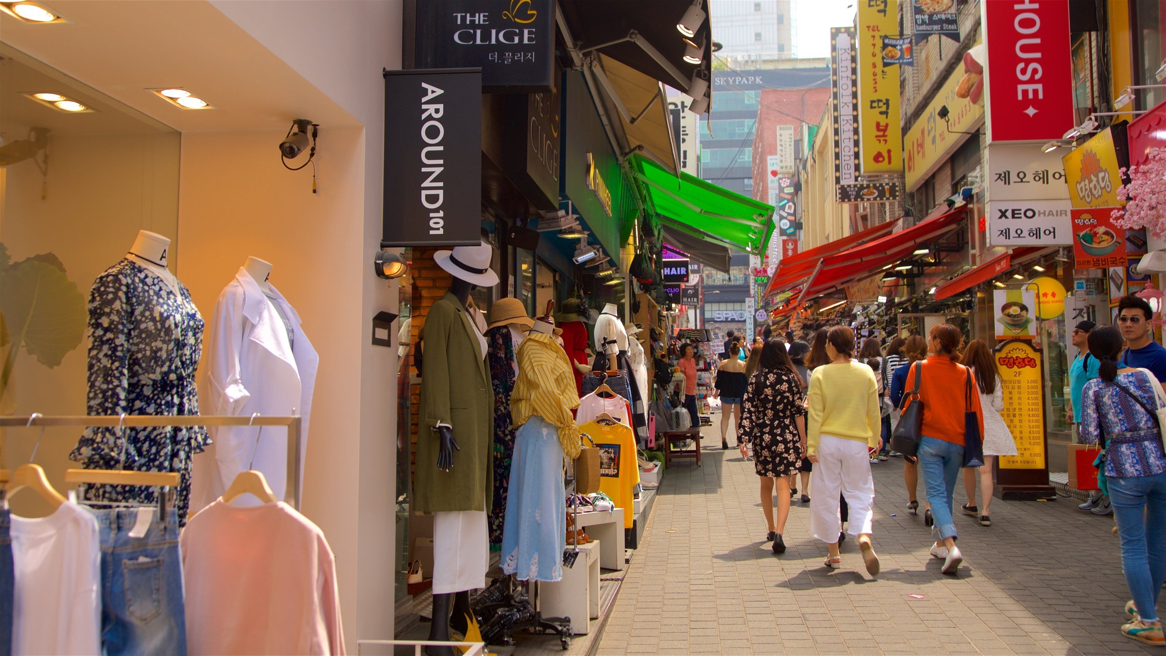 Myeongdong showing shopping as well as a small group of people