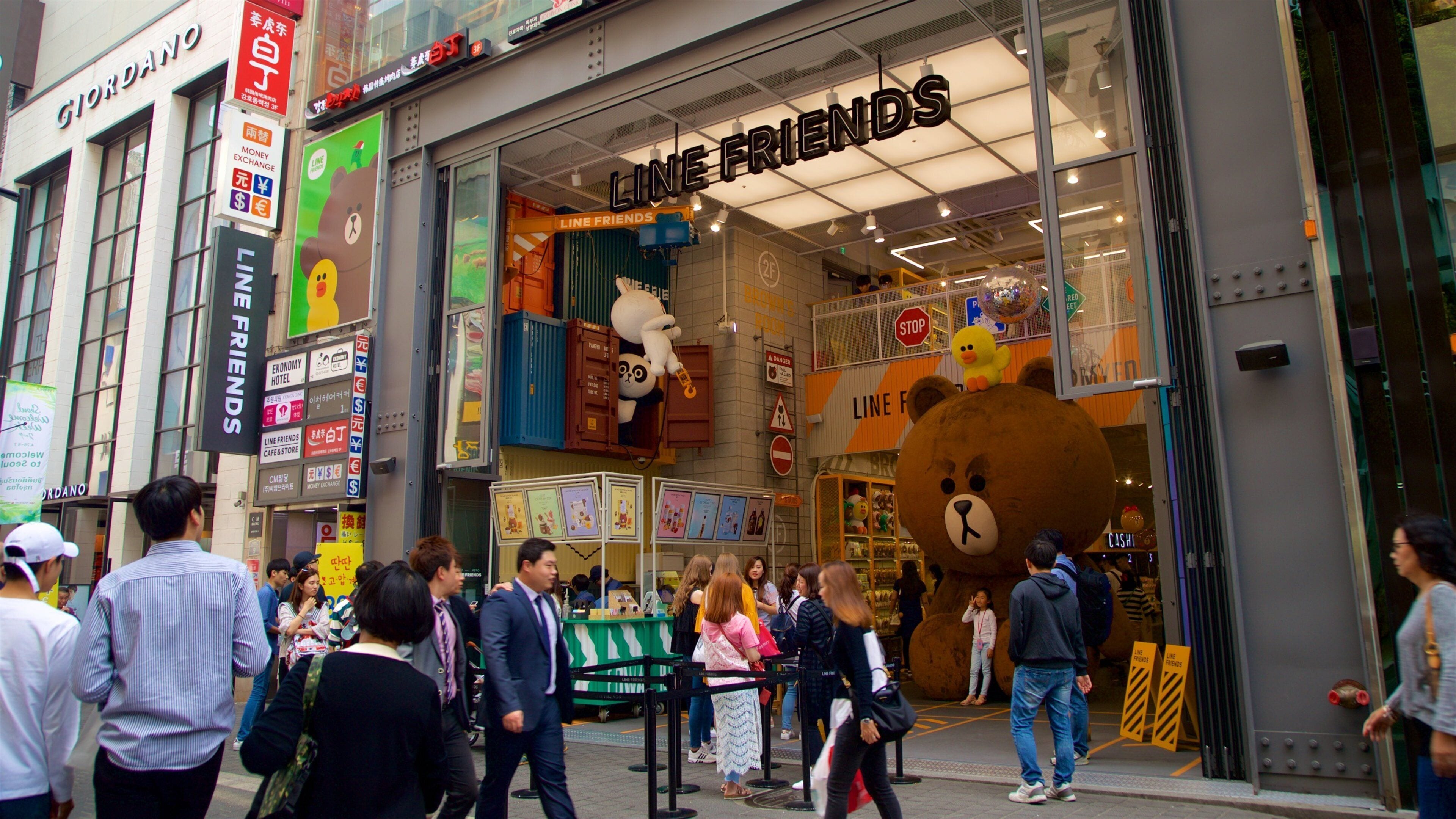 A storefront with a large bear mascot and the name "LINE FRIENDS".