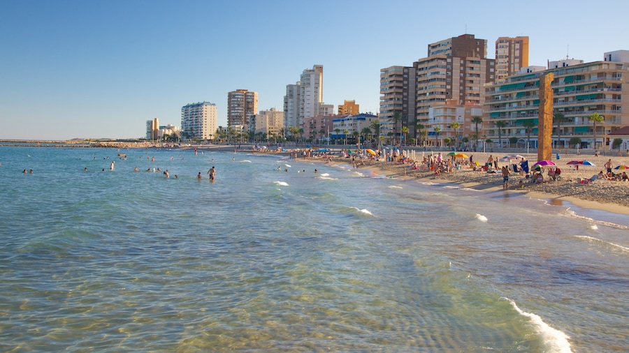 Campello Beach which includes swimming, a coastal town and a luxury hotel or resort