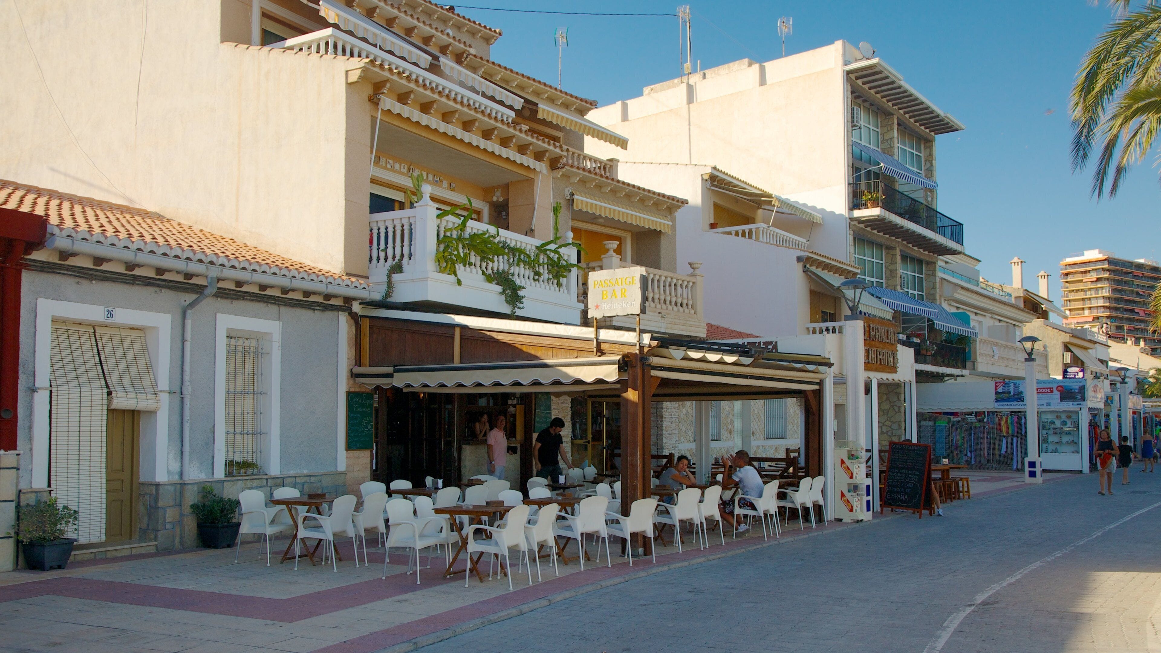 Campello Beach featuring outdoor eating, a coastal town and street scenes