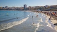 Playa de El Campello mostrando natación, una playa y una localidad costera