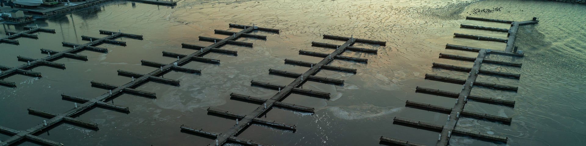 A network of wooden piers extending into a body of water.