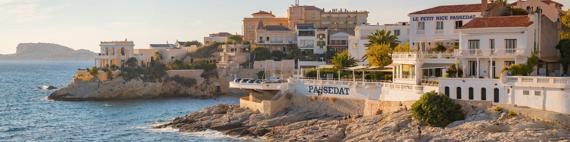 La Corniche which includes a sunset, general coastal views and rocky coastline