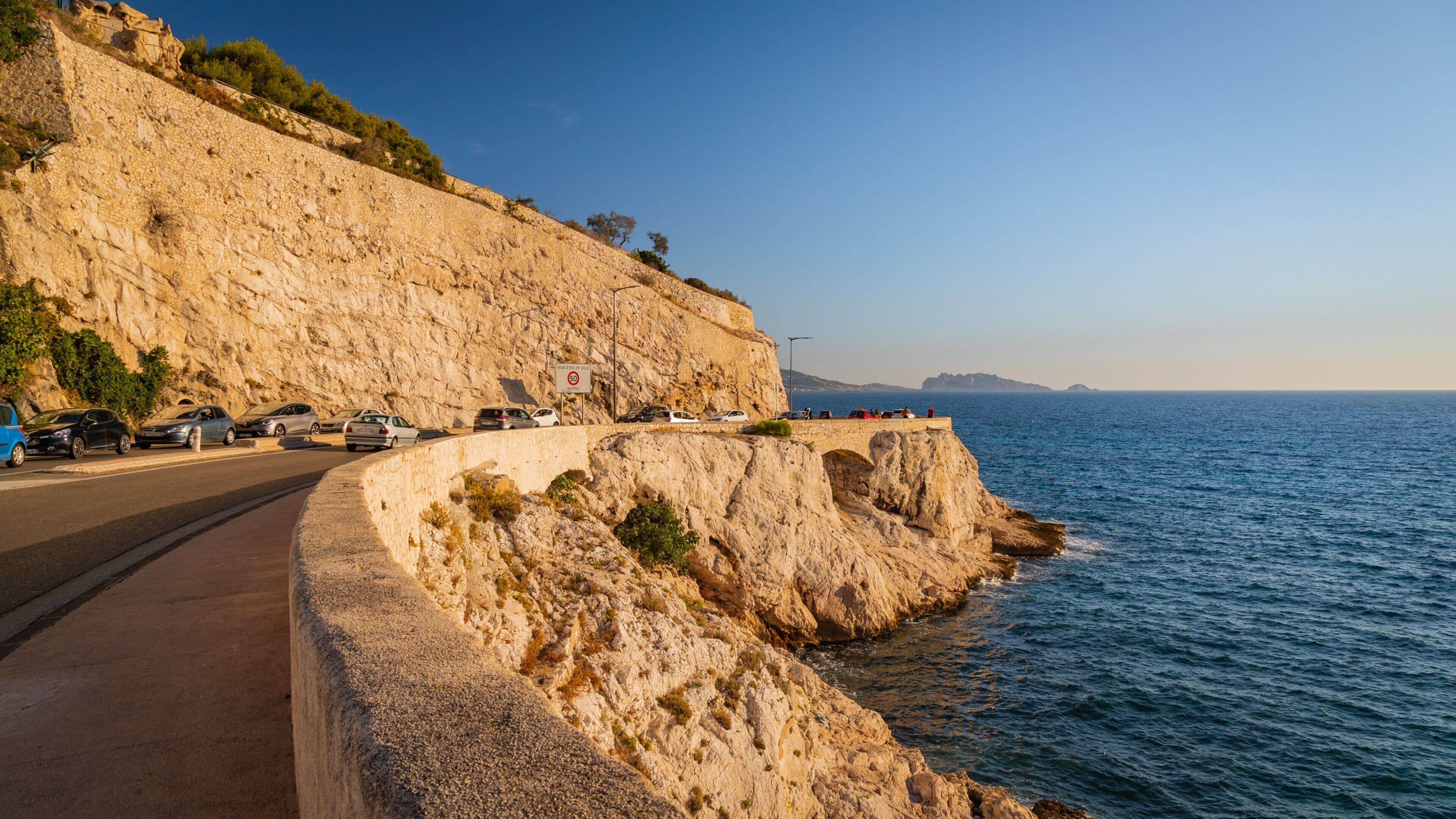 La Corniche which includes general coastal views and rocky coastline
