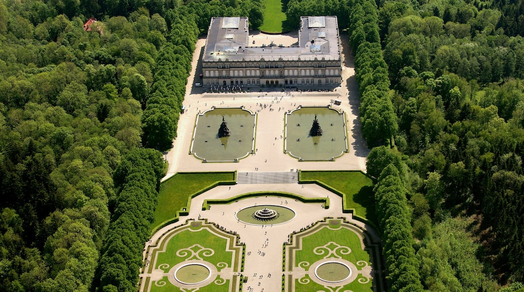Herrenchiemsee New Palace which includes landscape views, heritage architecture and a park