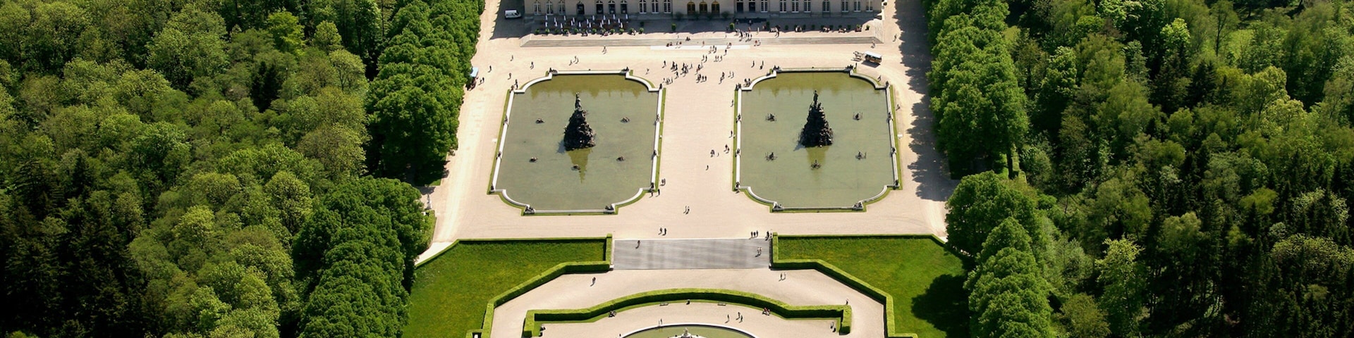Herrenchiemsee New Palace which includes landscape views, heritage architecture and a park