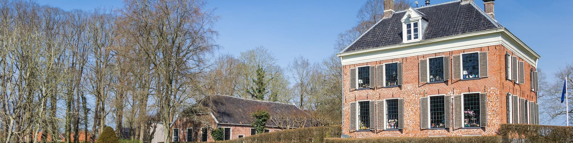 Panorama of the historic mansion Ennemaborg and pond in Midwolda, Netherlands