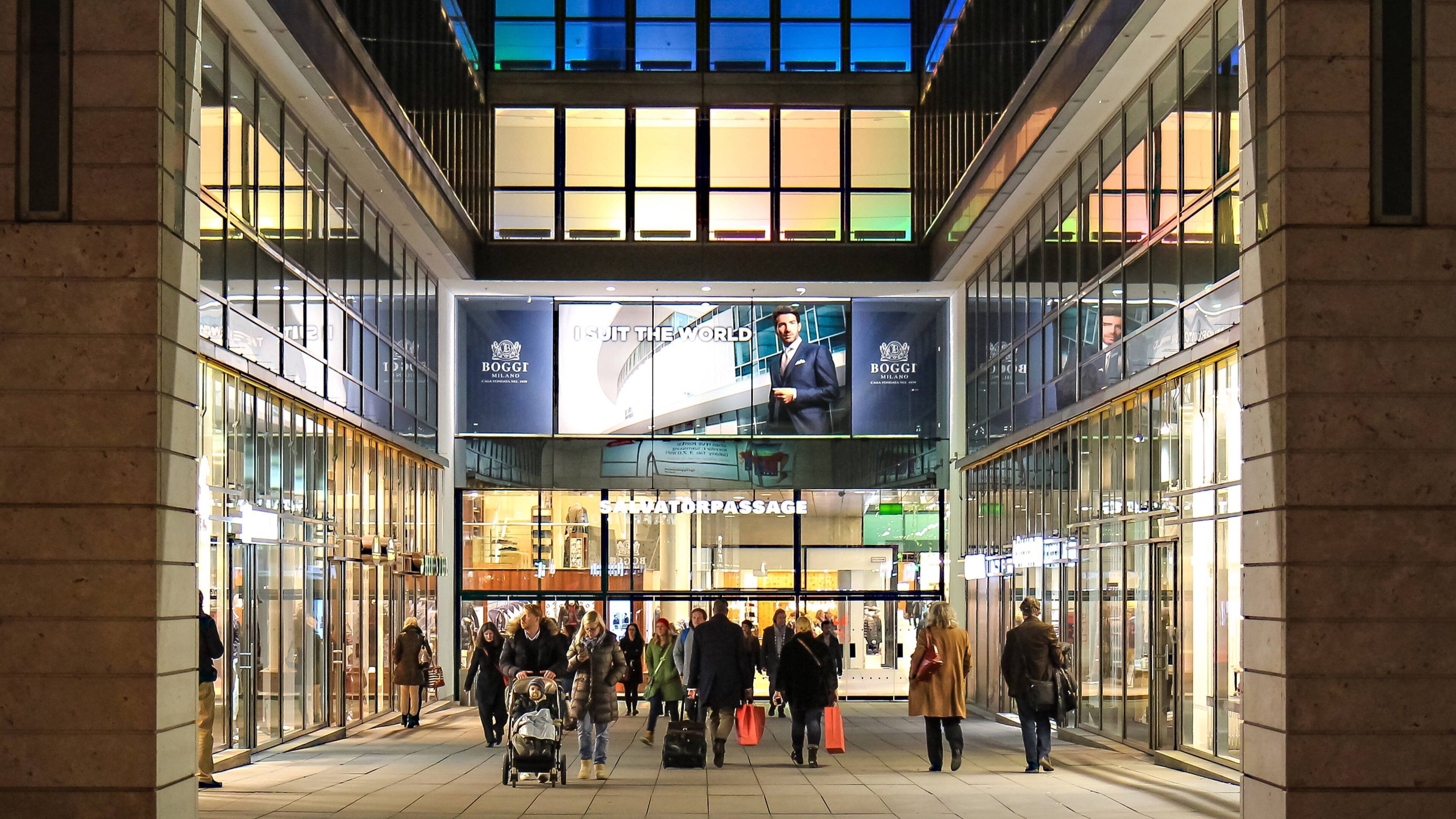 Funf Hofe featuring night scenes and street scenes as well as a small group of people