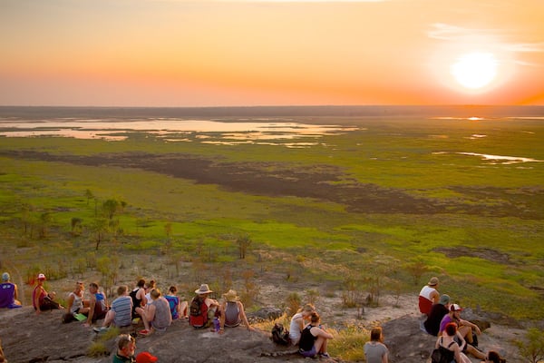Ubirr showing a sunset as well as a large group of people