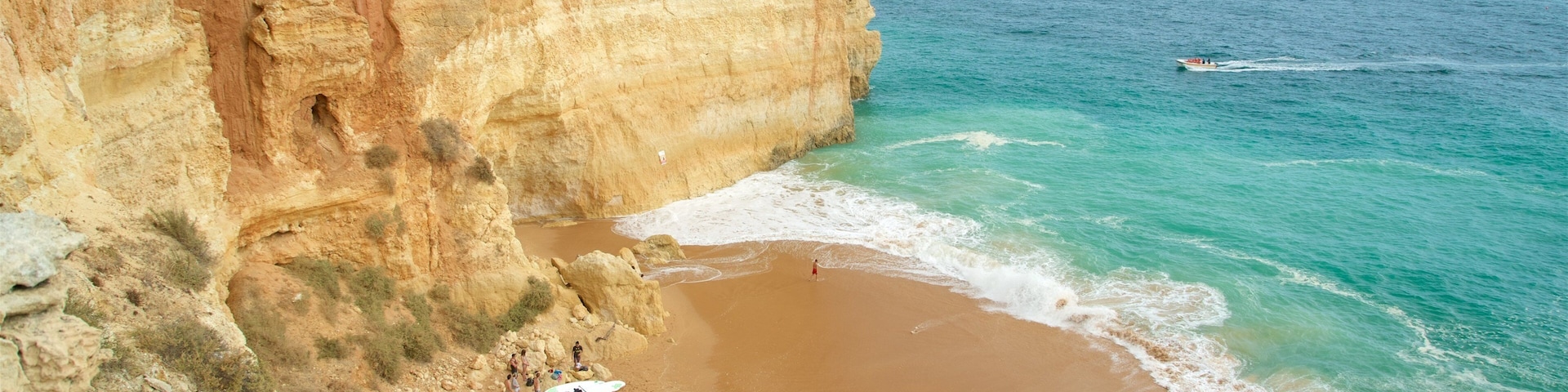 Benagil Beach featuring rocky coastline, general coastal views and a sandy beach
