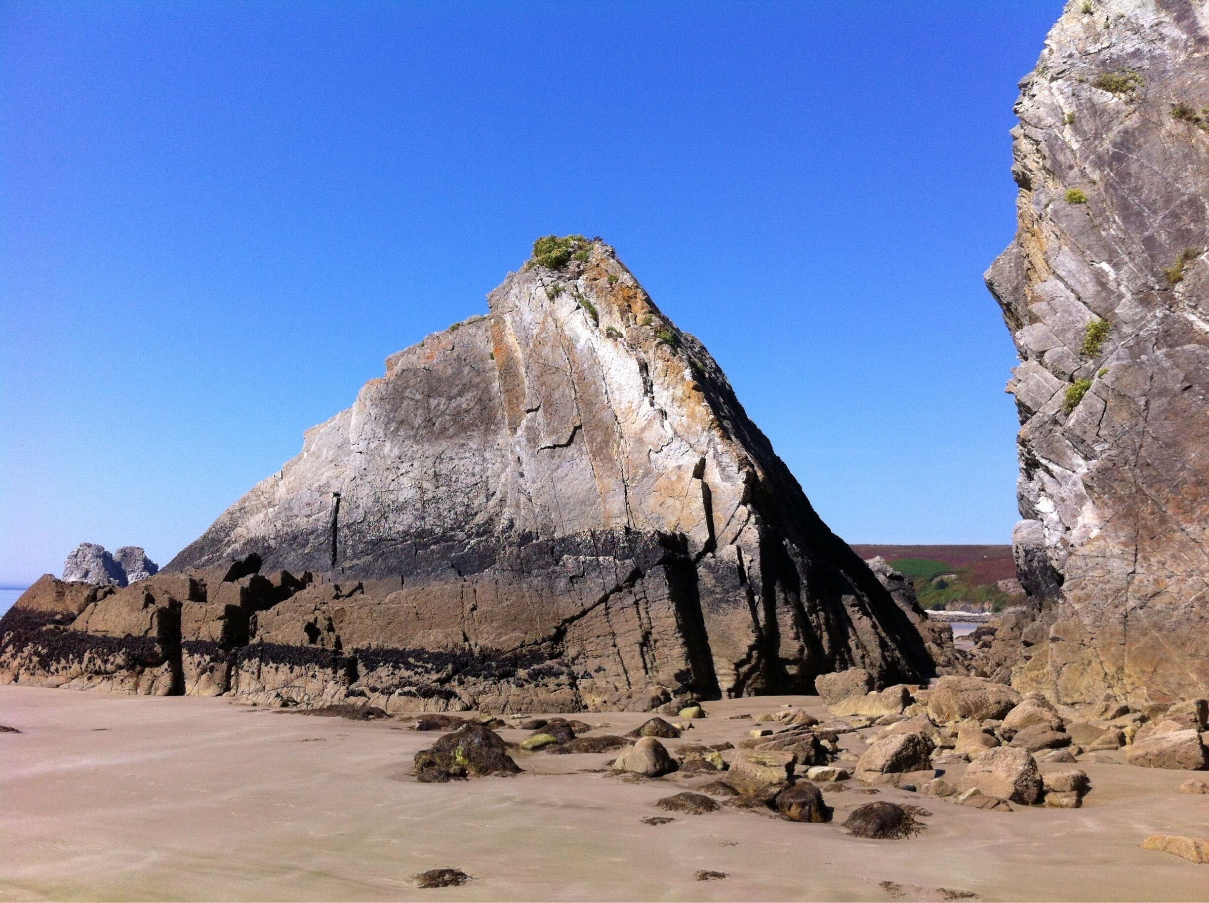 A beach for geology enthusiasts. Cool rock formations and fossils in the cliffs. 