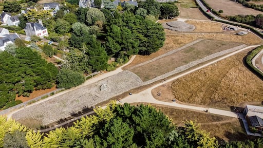 Aerial view of the Locmariaquer megalithic site near Carnac in Brittany, France - Prehistoric Er grah tumulus made out of limestone in Morbihan