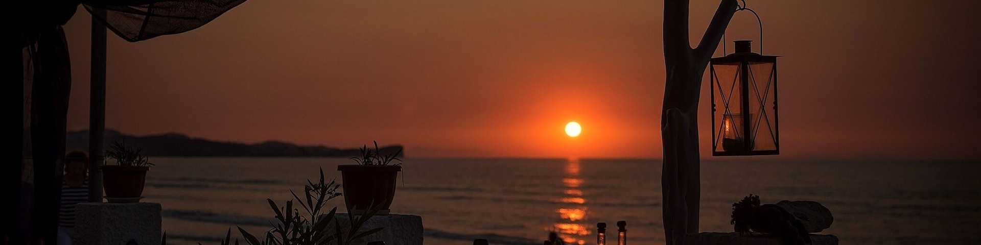 Sunset at Afros Tavern in the seaside town of Acharavi, Corfu. Sat here sipping wine watching the sun disappear - heaven