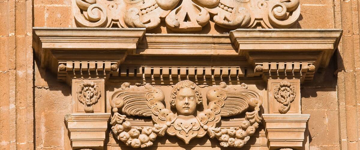A detailed stone carving with intricate designs and figures.