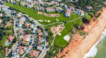 Luxury Living in the Golden Triangle: Cinematic 4K Aerial of Vale do Lobo Royal Golf Course and the Iconic Crimson Cliffs of Praia do Trafal, Algarve, Portugal